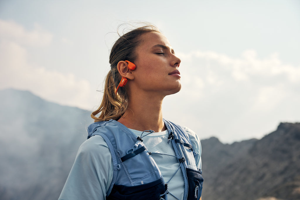 Shokz OpenRun Pro 2 Wireless Open-Ear Headphones runner wearing them